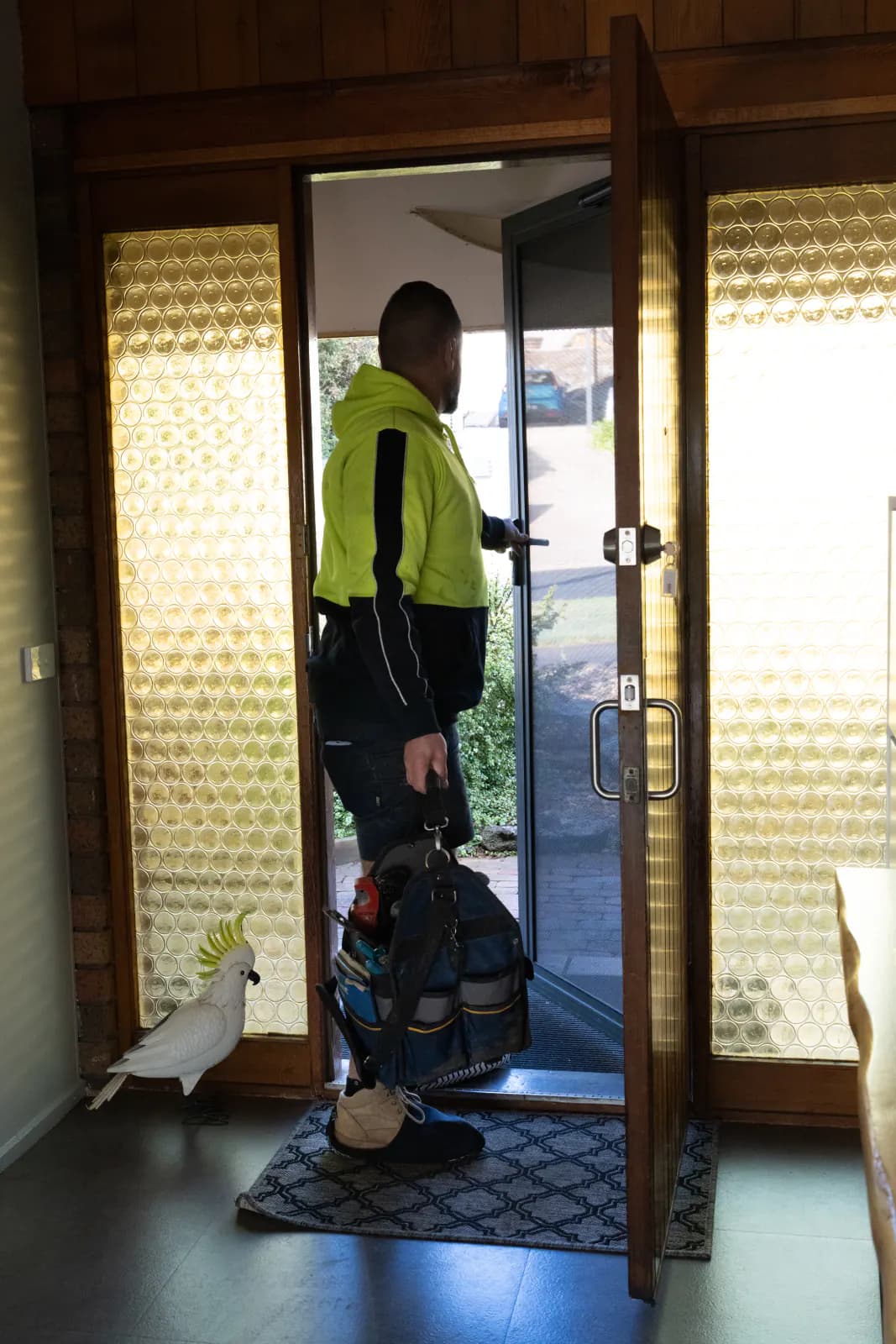 Arriving at a customer's front door with a tool bag